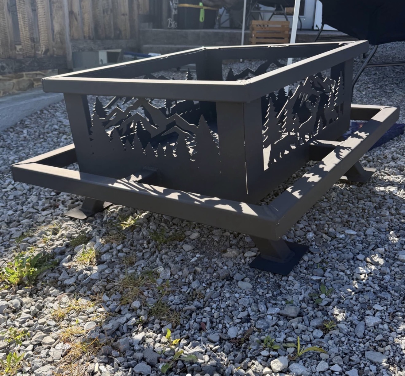 Square custom mountain and wildlife fire pit