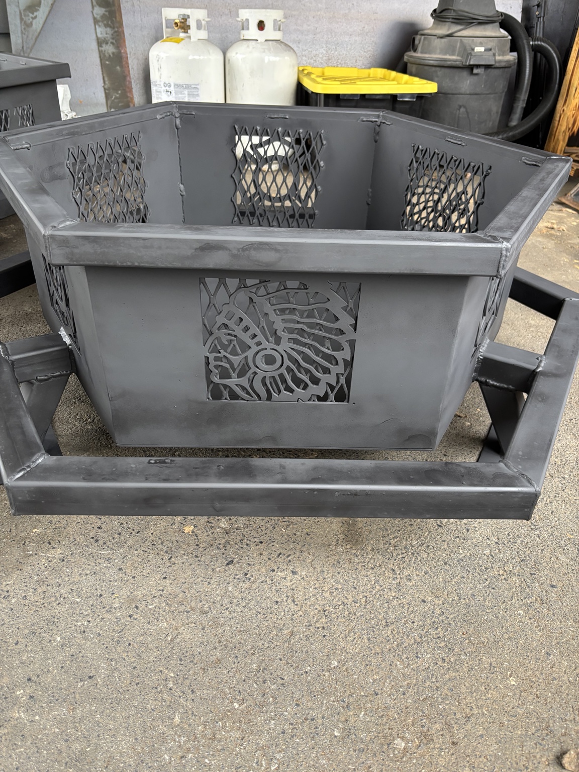 Custom hexagonal fire pit with Native American design