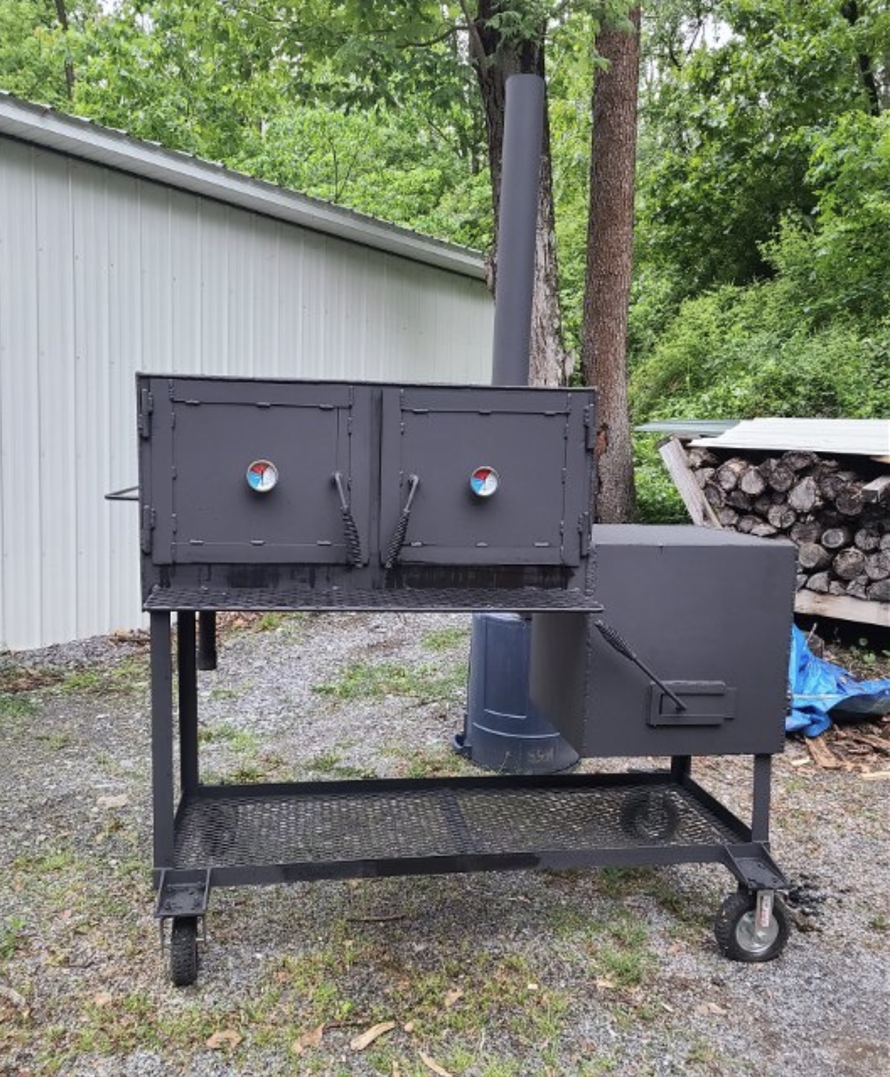 Double-door cabinet smoker on a rolling cart